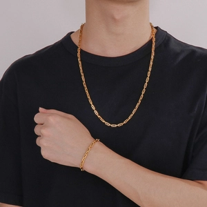 Gold plated minimalist geometric chain necklace and bracelet set for men on model