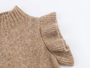 Detailed view of camel knit top with elegant mock neck and layered ruffled shoulders