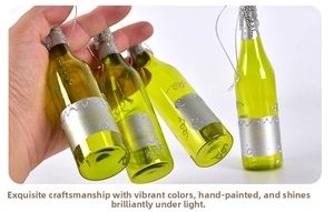 Detailed view of hand-painted green wine bottle glass ornaments with silver glitter accents