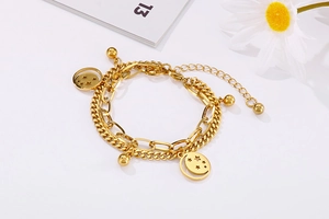 Detail of double-layer gold star and moon stainless steel bracelet with adjustable clasp