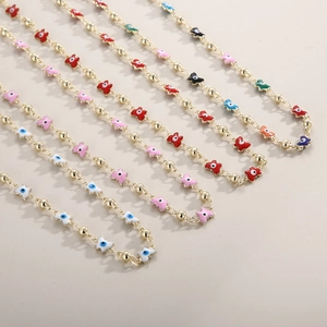 Golden evil eye butterfly necklaces with colorful enamel pendants in various shades