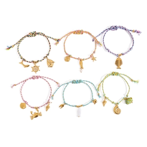 6-piece ocean-themed woven bracelets with gold sea creature charms and adjustable cords