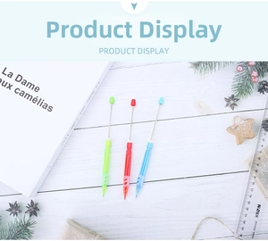 Detailed view of DIY beadable mechanical pencils in green, red, and blue pastel colors