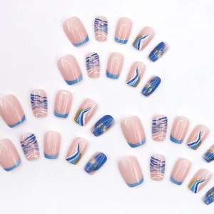 Blue and white marble press-on nails with gold foil in short squoval shape