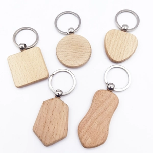 Set of 5 unique DIY wooden keychains in various shapes with polished metal rings