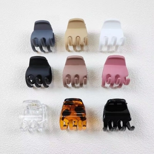Set of nine 3.5cm square claw clips in various matte and glossy colors for hair styling