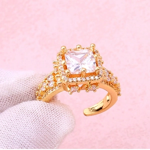 Macro view of adjustable copper ring with square-cut zircon and micro-pave details