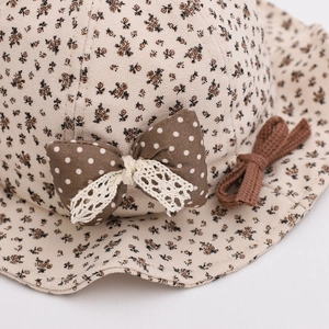 Baby floral bucket hat with brown bow and lace trim in vintage beige cotton fabric