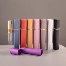 Detailed row of multi-colored 10ml portable perfume spray bottles with glass inner liner
