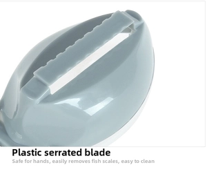 Macro view of the jagged plastic blade on a gray manual fish scale remover tool