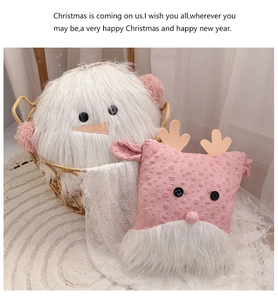 Plush Christmas snowman and reindeer decorative cushions in a woven basket display