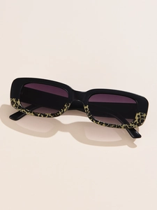 Detail of rectangular sunglasses featuring leopard print trim and purple gradient lenses