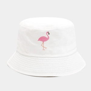 Close-up of pink flamingo embroidery on a white cotton bucket hat with detailed stitching