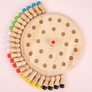 Educational wooden memory chess game with colorful pegs and dice on a pink background