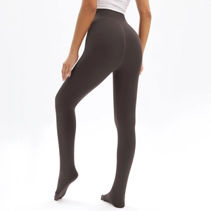 Detail view of high-waisted dark brown thick leggings with push-up effect and footed style