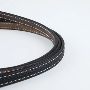Close-up of lychee grain leather strap with white stitching for shoulder bags