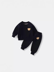 Kids warm black fleece tracksuit set with cute brown bear embroidery on plain background