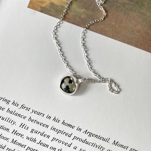 Minimalist 925 sterling silver necklace featuring a round zebra jasper stone pendant