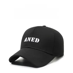 Close-up of ANED letter embroidery and reinforced stitching on a black baseball cap