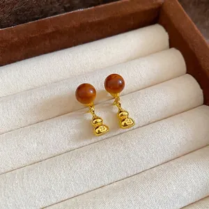Boucles d'oreilles chinoises avec perle ambrée et gourde dorée en coffret cadeau