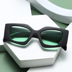 Chic cat eye kids sunglasses with black frame and green lenses for UV protection