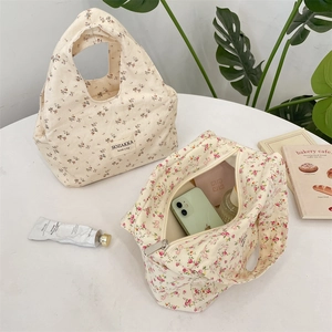 Detailed view of floral canvas lunch bag showing spacious interior for daily essentials
