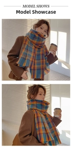 Close-up detail of soft plaid scarf featuring blue and orange patterns with fringe edges