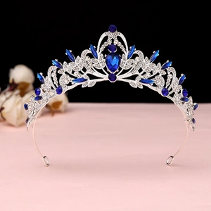 Detailed view of baroque tiara with navy blue gemstones and sparkling crystals