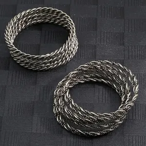 Hip hop punk style twisted rope bracelets for men featuring metallic wire textures