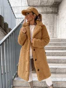 Close-up of camel teddy coat with lapels, single-breasted buttons and matching plush hat