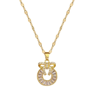 Luxurious gold-tone bow and ring pendant necklace with sparkling crystal inlay