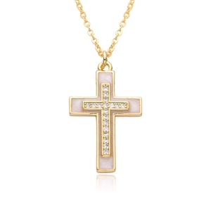 Detail of gold cross pendant with micro-pave white stones and glossy inlay