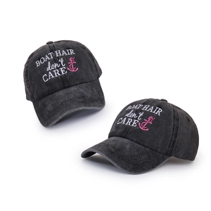 Close-up of boat hair don't care embroidery on washed cotton baseball caps