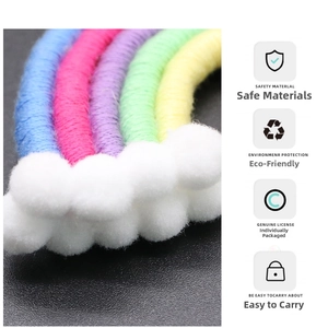 Detailed view of handmade rainbow keychain featuring soft cotton cords and plush white clouds