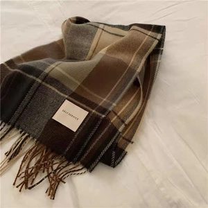 Chic brown plaid cashmere-feel winter scarf with cozy tassels and minimalist label design.