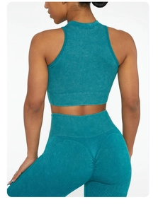 Close-up of ribbed scrunch butt leggings and crop top in vintage teal blue wash