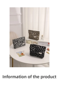 Close-up of leopard, zebra, and cow print plush makeup bags with premium zipper detail