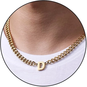 Men's 18K gold plated D initial pendant on a cuban chain necklace worn by a male model