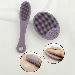 Close-up of silicone face cleaning brushes with soft bristles and suction cup base