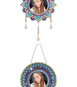 Detail of DIY diamond painting mirrors with mandala patterns and crystal pendants
