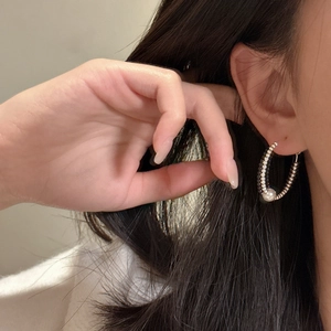 Elegant S925 sterling silver hoop earrings with bead texture and a white pearl on ear
