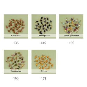 Macro display of five gemstone charms including Goldstone and Zircon for DIY jewelry