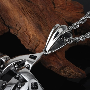 Close-up of a silver vintage-style Celtic star pendant on a black rope chain