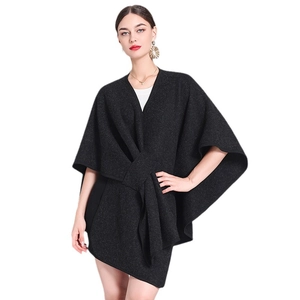 Women's black knit poncho cape with front knot detail in loose fit style