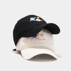 Cotton baseball caps in black and cream featuring colorful planet embroidery design