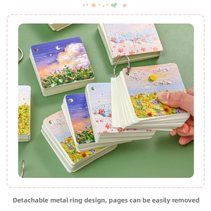 Detail of oil painting flashcards with detachable metal rings on green background
