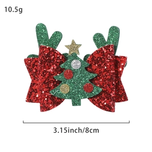 Christmas bow hair clip with red sequins, green reindeer antlers and mini tree decoration