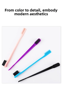 Detail of four colorful double-sided edge brushes for hair styling and eyebrow grooming