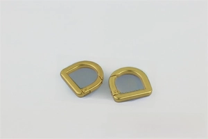 Detail view of 20mm D-ring spring clasp buckle in matte gold for handbags and bag straps