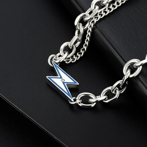 Silver cuban chain necklace with blue and white lightning pendant and small diamond